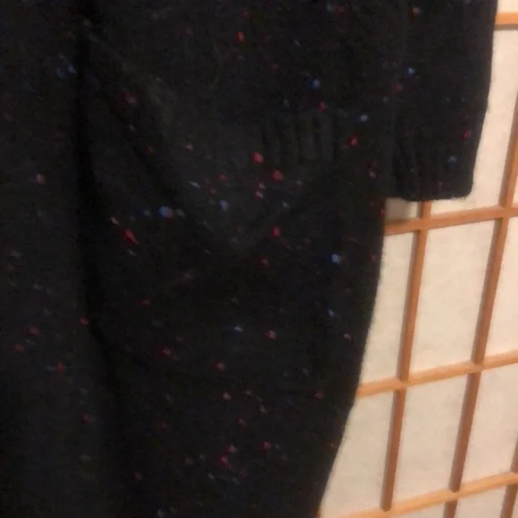 Long sweater jacket with belt.  Black with a few colored fabric spots. - Picture 6 of 7